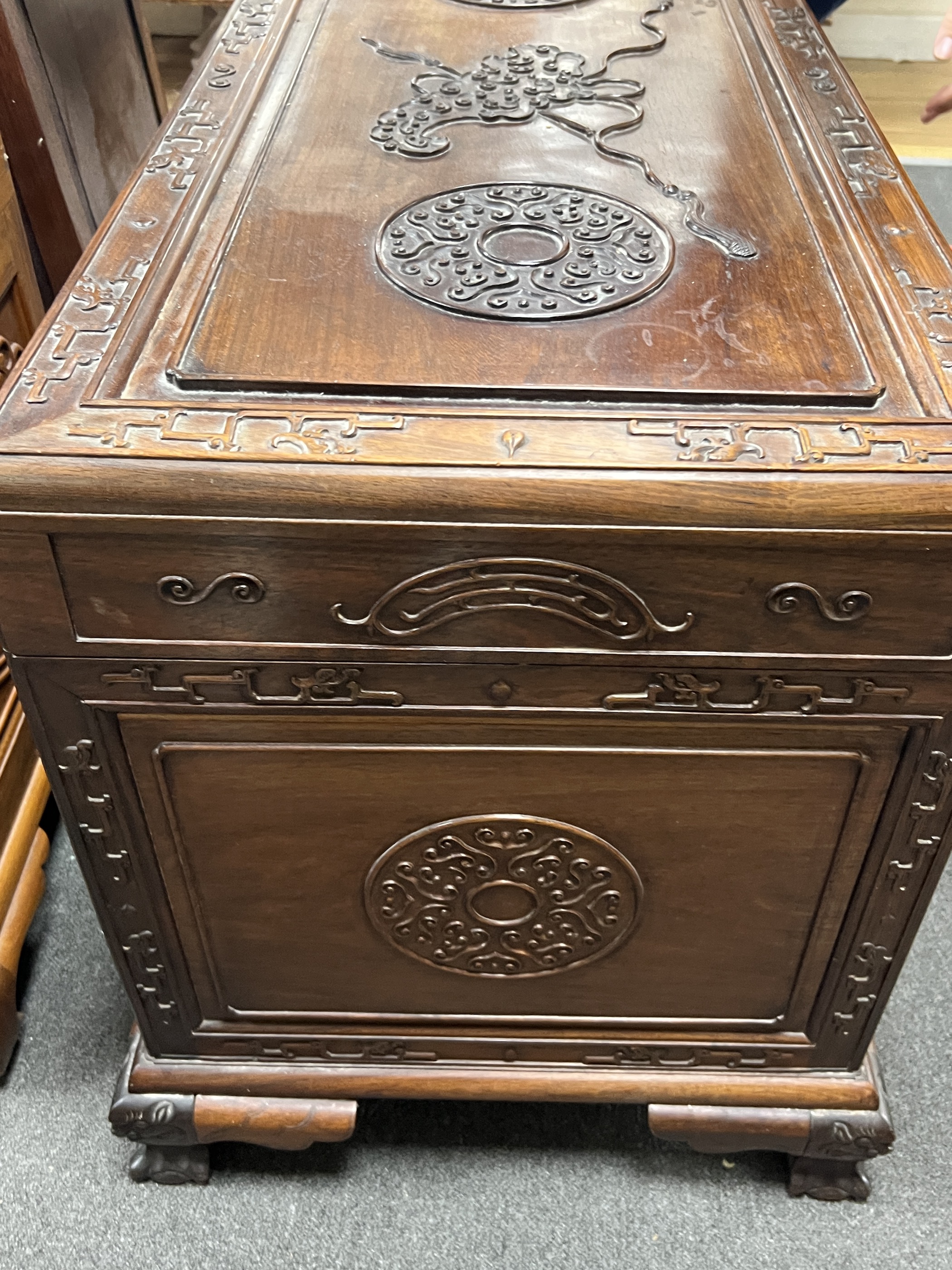 An Asian carved camphorwood trunk, width 100cm, depth 49cm, height 64cm